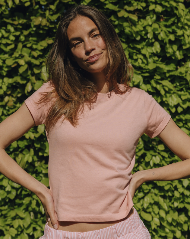 Daily Drills light pink cropped tee.